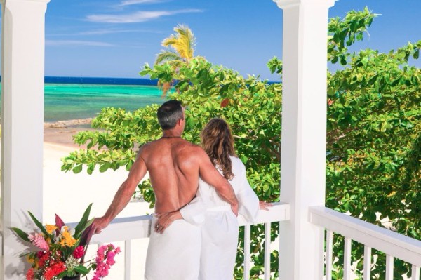 couple looking at the tropical island view before them on Roatan