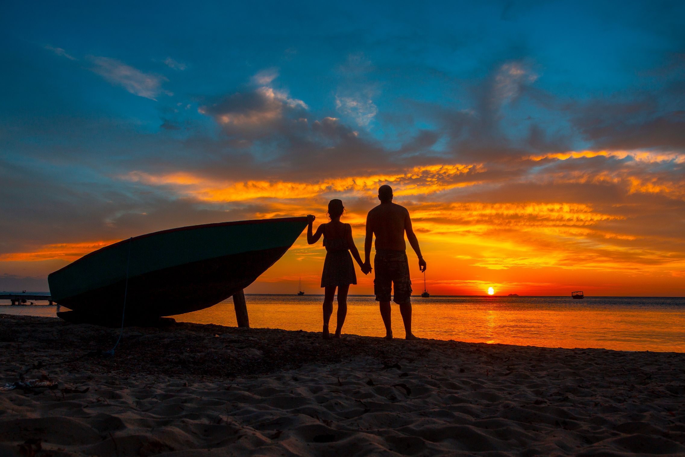 A couple in love at Roatan Sunset from West End. Honduras By unai